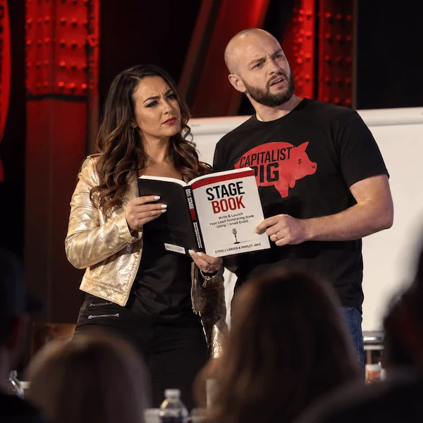Steve and Marley on stage holding The StageBook