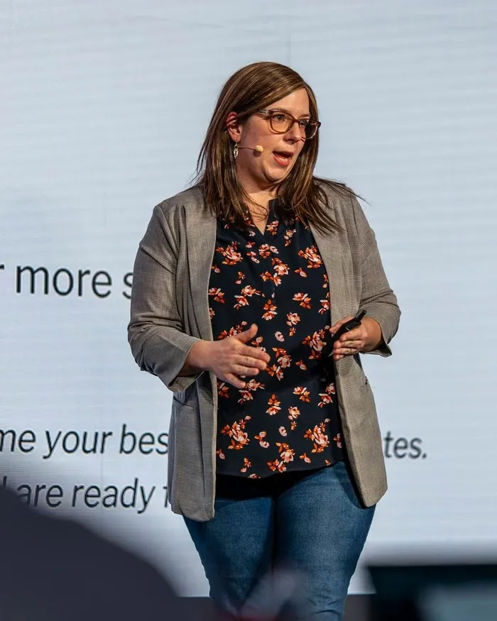 An author teaching a small room on the Pursuit of Profit stage